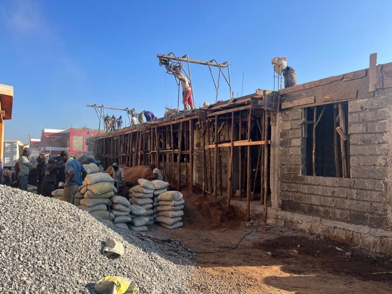 Timber formwork and stone walling during construction of the AIPCA Church Hall