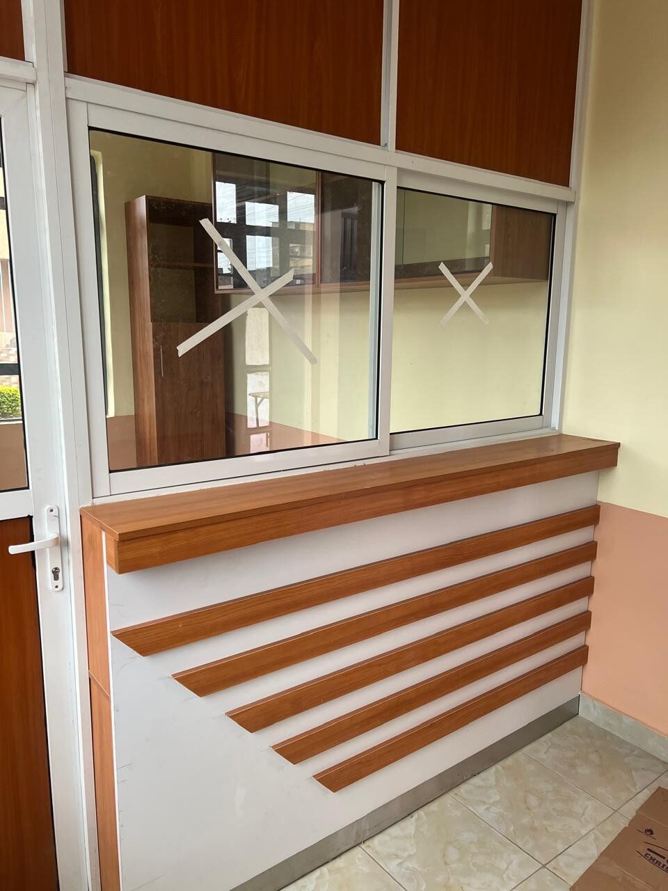 Completed service counter with timber-panelled base inside the church hall