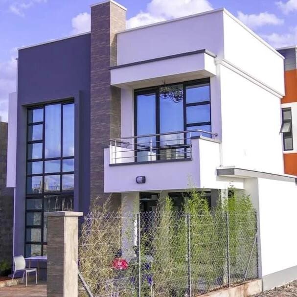 Front elevation of the Kenyatta Road maisonette with balcony and large windows