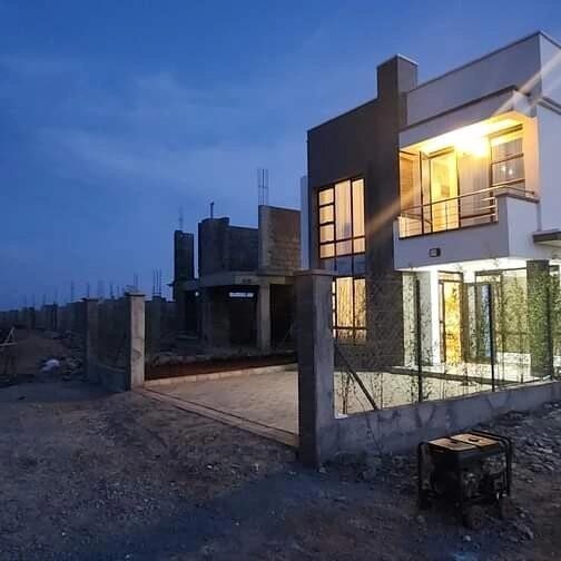 Kenyatta Road maisonette at dusk during the finishing stage