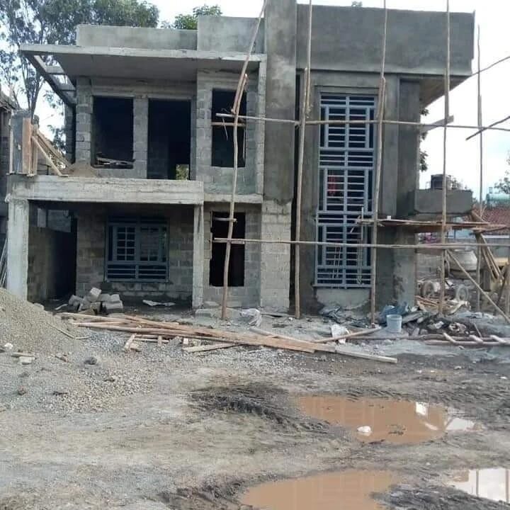 Blockwork and metal window frames during construction of the maisonette