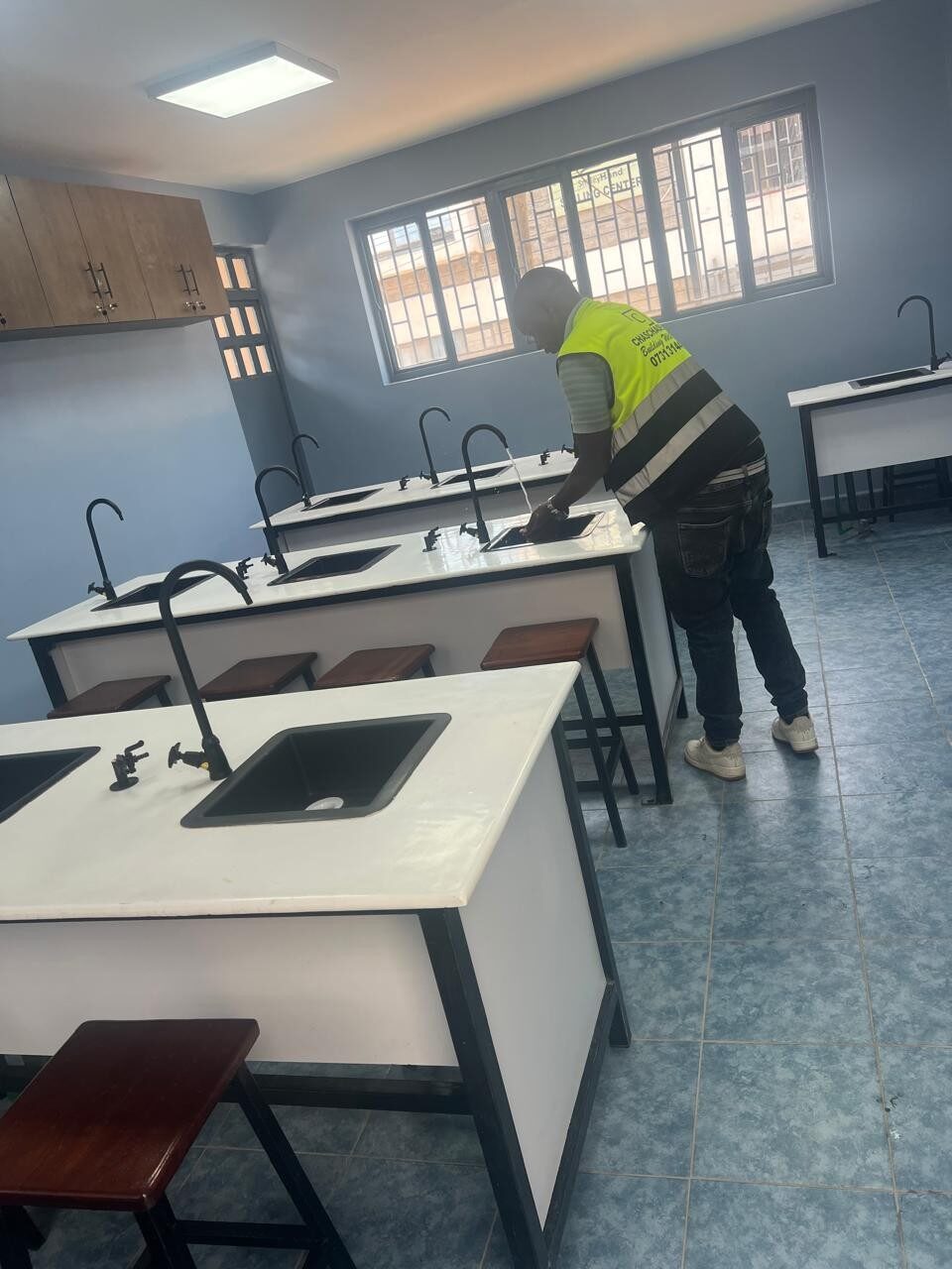 Chaschase technician commissioning a laboratory sink and tap