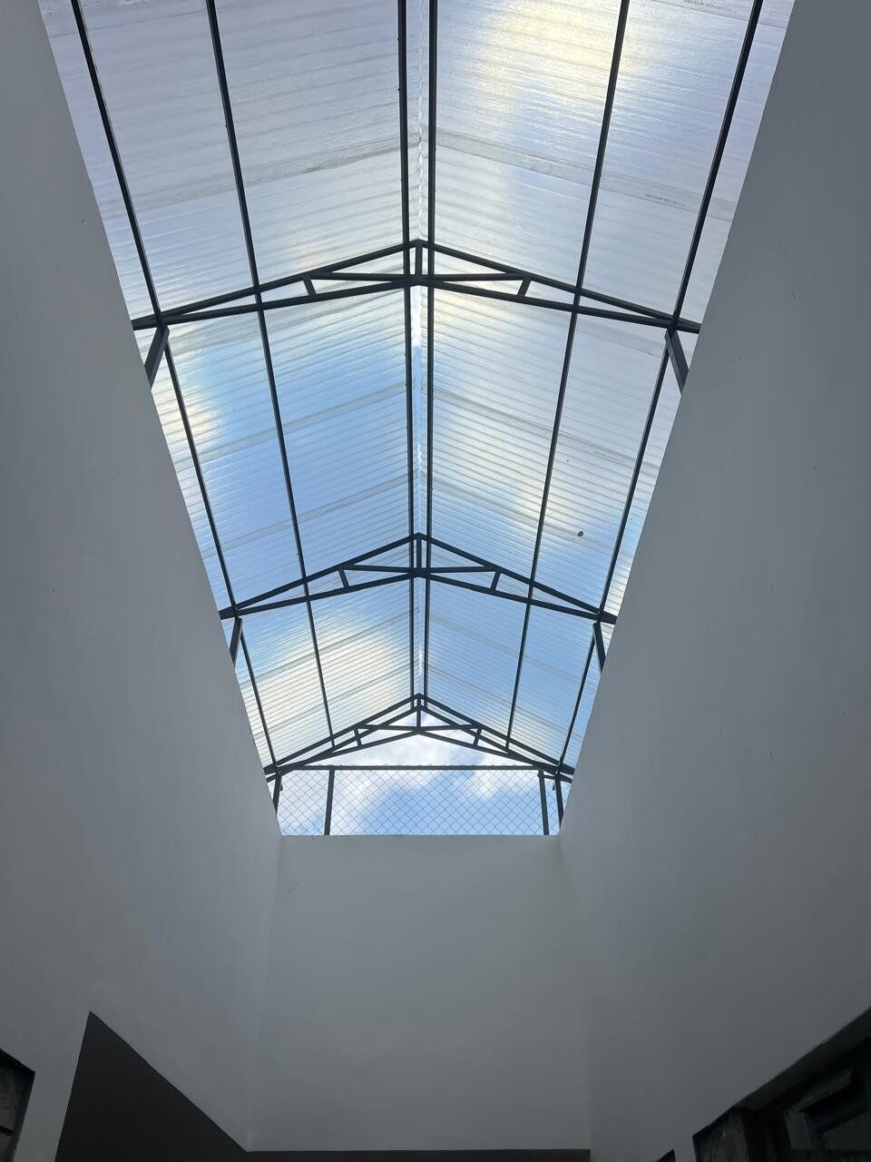 Steel-framed translucent skylight roof over the Smiling Centre atrium